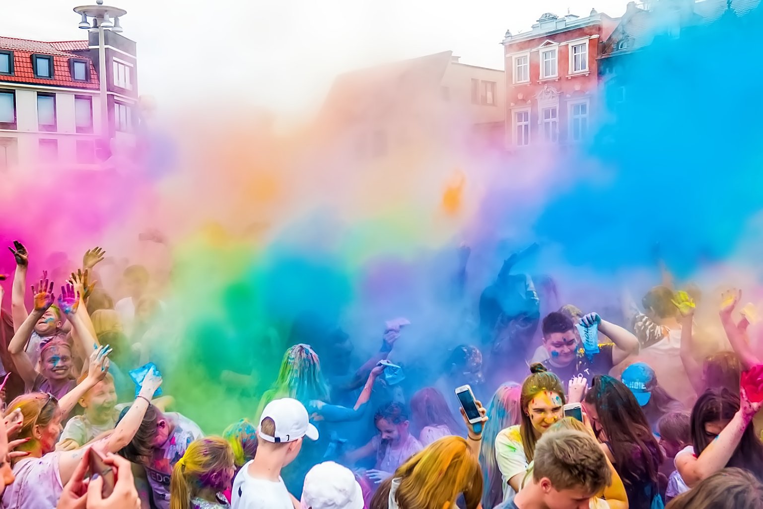 people throwing colorful powder on everyone studio simple